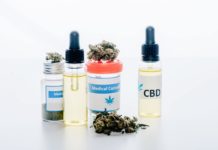 cannabis oil in bottles with lettering cbd and medical cannabis on white background