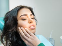 Young woman having toothache