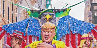 Allegorical car with Donald Trump doll during performing Grand show Mardi Gras parade