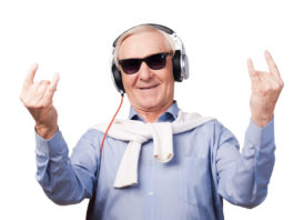 Cheerful senior man in headphones