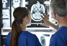 Radiologists looking at brain scans