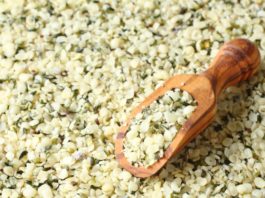 Shelled hemp seeds in wooden scoops, one of the superfoods