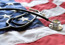 United States America healthcare medical concept - stethoscope on American flag,