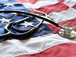 United States America healthcare medical concept - stethoscope on American flag,