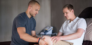 Hes an amazing physiotherapist. Shot of a physiotherapist examining a man with an amputated leg.