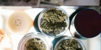 Green kush in clear glass container