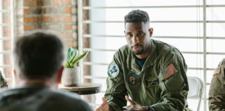 Photo of soldier talking to his team mates