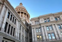 The Texas State Capitol set against a clear blue sky.
