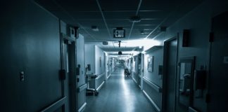 Empty long corridor of modern hospital