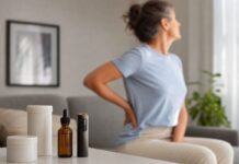 Interacciones del CBD con fármacos para el dolor Aceite de CBD y vaporizador sobre una mesa junto a una mujer con dolor de espalda al fondo